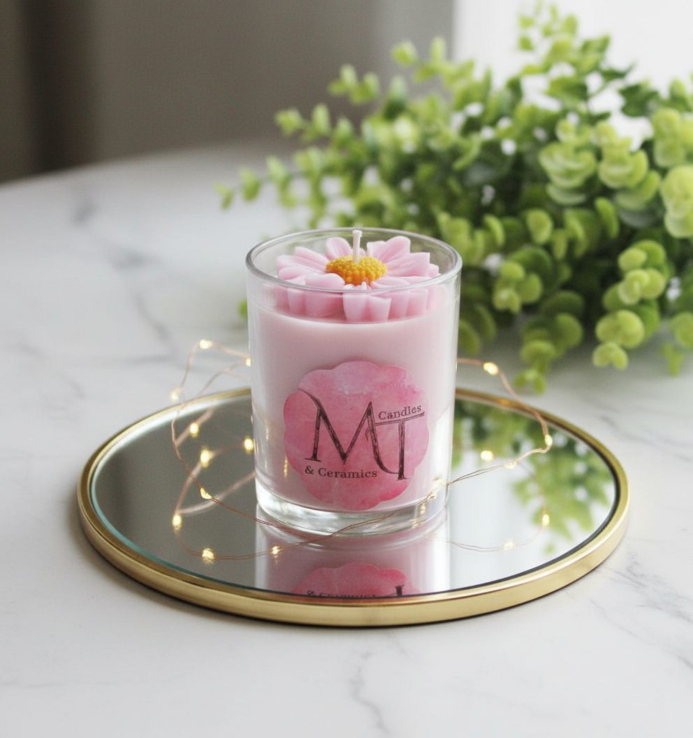 Handcrafted pink scented candle in glass — floral elegance and a soft, romantic aroma.
